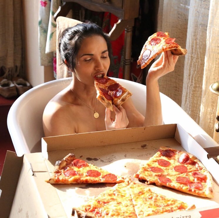 Padma Lakshmi Goes Topless for Pizza Party in Bathtub.