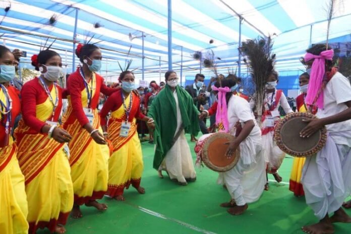 Watch video of mamata banerjee dance with tribes during a mass wedding ceremony
